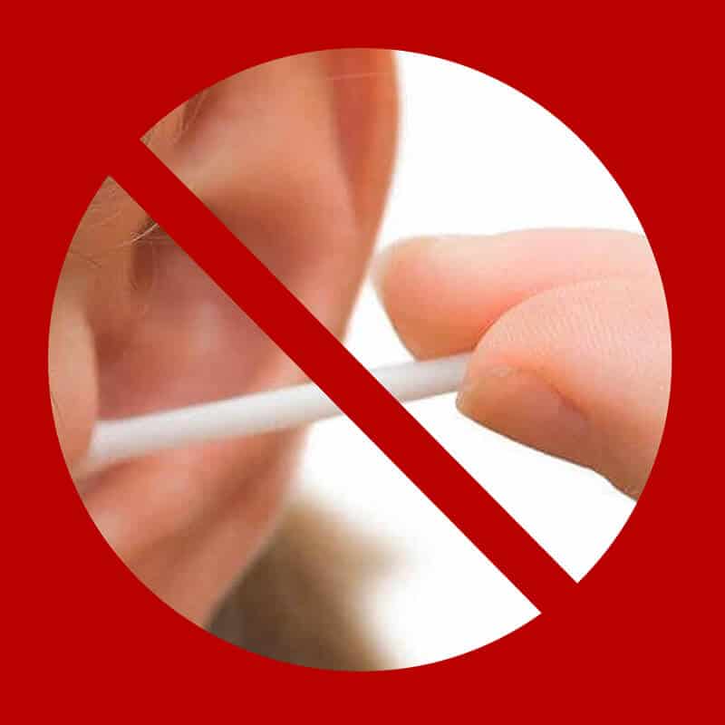 audiologist removing earwax (cerumen) from the ear canal
